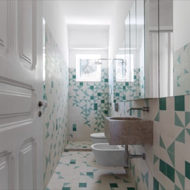 mosaico hidráulico nas paredes e pavimentos numa casa de banho projectada pelos arquitectos Sofia Saraiva e Pedro Rogado